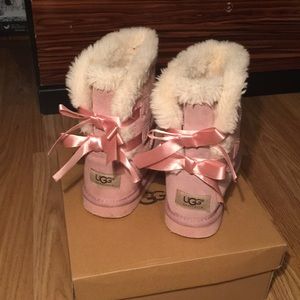 UGG Shoes - Pink girls Ugg boots with bows, worn UGG Shoes - Pink girls Ugg boots with bows, worn